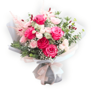 A beautifully handcrafted Women's Day bouquet featuring vibrant red and soft pink roses, delicate baby's breath, and lush greenery, elegantly wrapped in a soft pastel arrangement. Available for delivery in Oshawa & GTA.