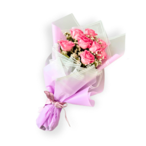 A delicate and elegant Women's Day bouquet featuring soft pink roses, accented with baby's breath and wrapped in a luxurious pastel lavender wrap. Available for delivery in Oshawa & GTA.