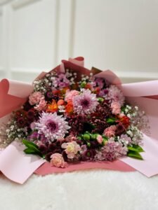 Beautiful bouquet with pink roses and chrysanthemums, perfect for special occasions.